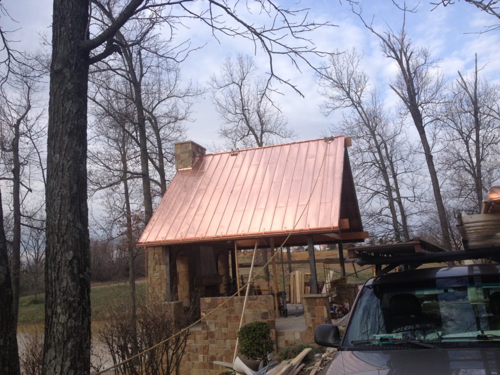 after- copper roof and chimney cap